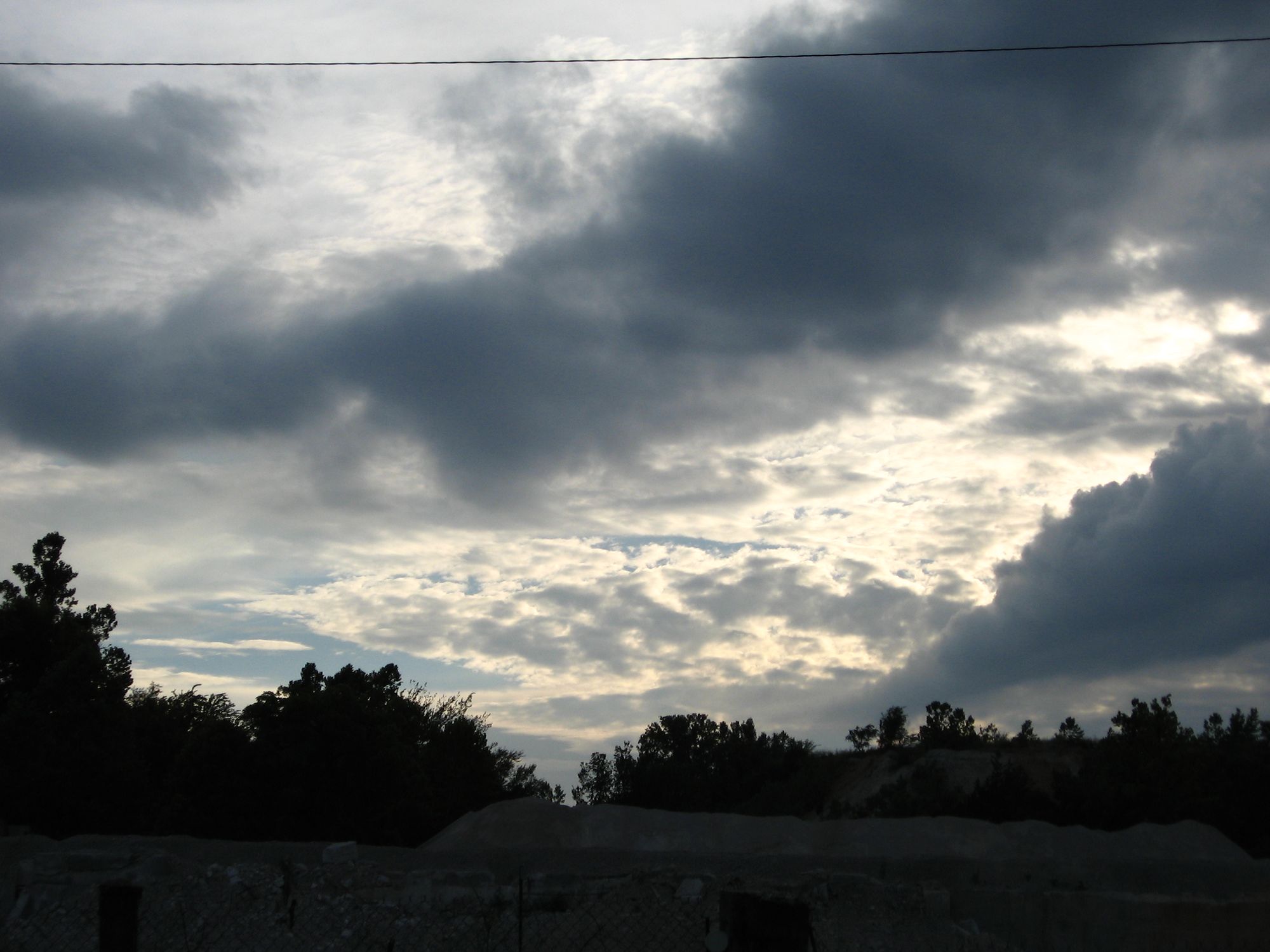 cloudy sky over a limestone quarry